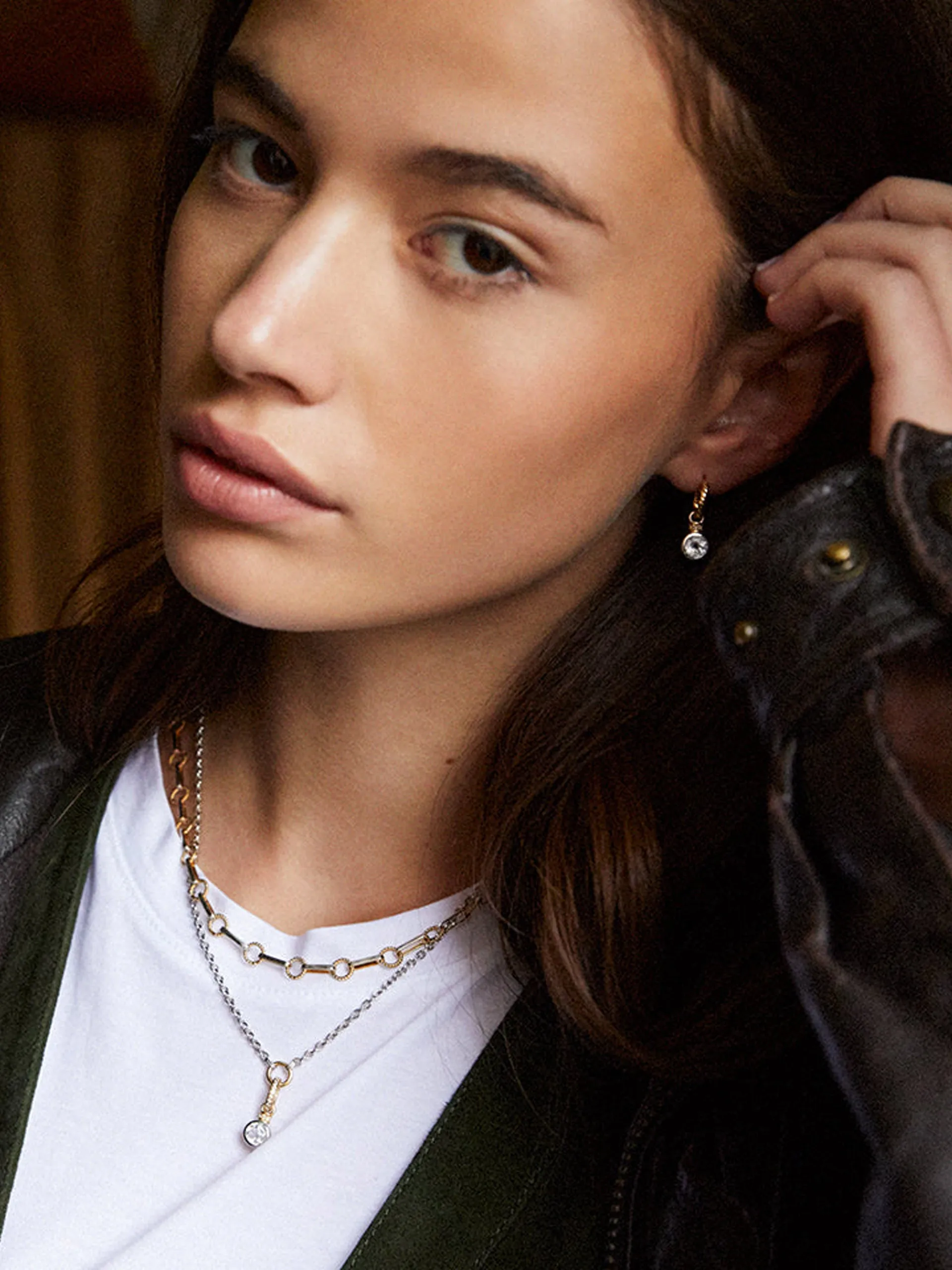 Brilliant cut charms on twisted hoops